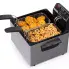 The Dual Basket ProFry immersion element deep fryer with the cover off. Fritters and calamari are in the baskets.