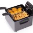 The Dual Basket ProFry immersion element deep fryer with the cover off. Fritters and calamari are in the baskets.