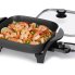 The 11-inch Electric Skillet with the cover off and shrimp cooking inside.