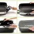 A four frame montage showing how the 16-inch Electric Foldaway Skillet's handles fold in for compact storage.