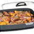Food cooking in the 16-inch Electric Slimline Skillet with the cover off.