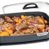 Food cooking in the 16-inch Electric Slimline Skillet with the cover off.