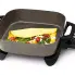The 12-inch Electric Skillet with the cover off and an omelette cooking in the pan.