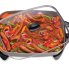 The 16-inch Electric Skillet with peppers and sausage cooking in the pan.