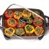 An overhaed view of the 16-inch Electric Skillet with stuffed peppers cooking in the pan.