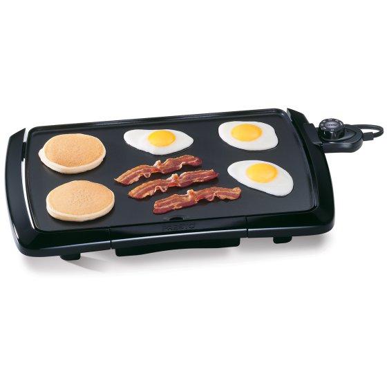 07047 Cool-touch Griddle cooking pancakes, bacon, and fried eggs.