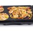 The Cool-touch Griddle cooking shrimp.