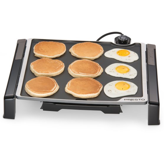 07071 Tilt-n-Fold Family-size Electric Griddle cooking pancakes and fried eggs.