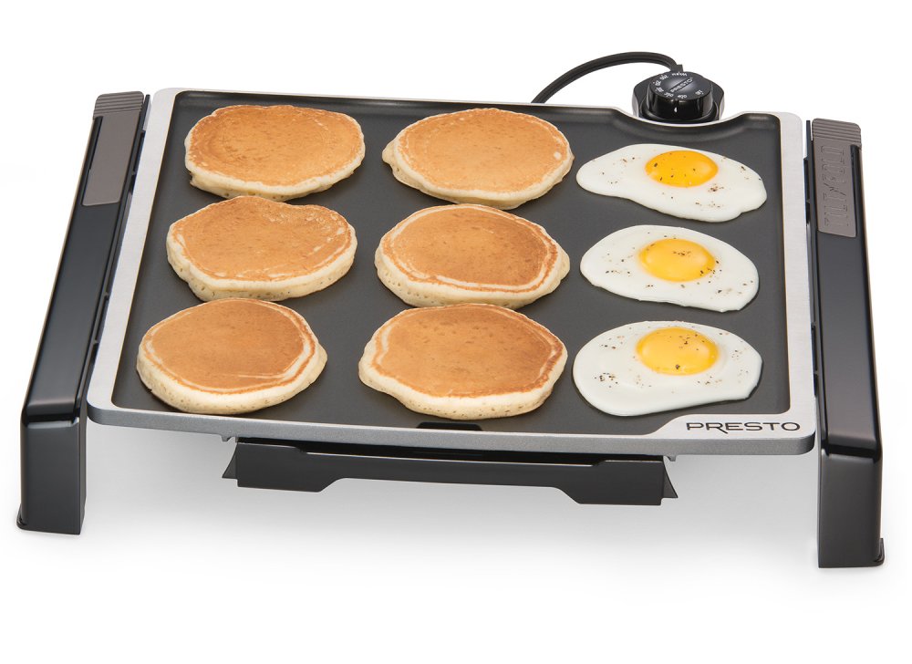 07071 Tilt-n-Fold Family-size Electric Griddle cooking pancakes and fried eggs.