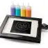The PanGogh Pancake Art Griddle with an art template on the griddle and four filled batter bottles.