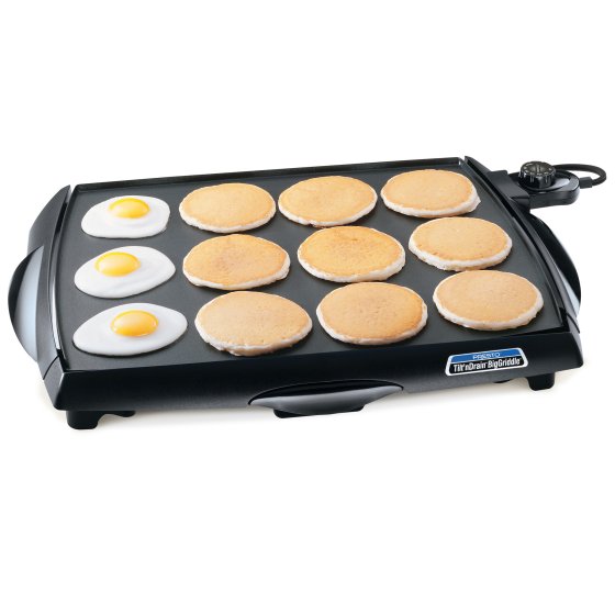07046 Tilt'nDrain BigGriddle cool-touch griddle with fried eggs and pancakes.