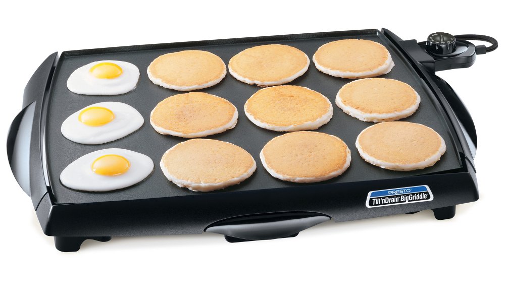 07046 Tilt'nDrain BigGriddle cool-touch griddle with fried eggs and pancakes.