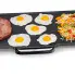 The 22-inch Electric Griddle cooking ham, fried eggs, and hash browns.