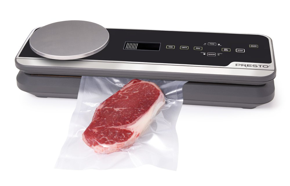 05623 FreshDaddy Vacuum Sealer with Digital Scale sealing a bag containing a steak.