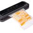 The FreshDaddy Compact Vacuum Sealer with a bag of vacuum sealed cheese.