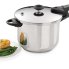 The 6-Quart Stainless Steel Pressure Cooker with chicken and green beans on a plate.