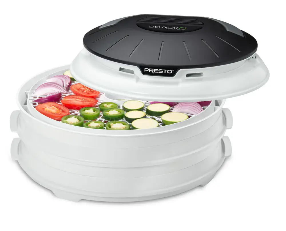 06300 Dehydro Electric Food Dehydrator with vegetables drying in the top tray.