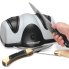 A knife being sharpened with the EverSharp electric knife sharpener.