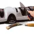 The Professional EverSharp three-stage electric knife sharpener being used to sharpen a knife.
