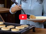 A scene from the Tilt-n-Fold XL Griddle video.
