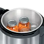 The Presto Precise 17-Quart Digital Pressure Canner with cover off and jars of carrots inside.