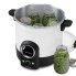 Presto Precise 23-Quart Digital Pressure Canner with the cover off and jars of green beans in and out of the canner.